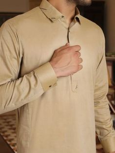 It is a men's Pakistani shalwar kameez design of 2019 trends. This men's shalwar kameez is in beige colour which is made from the high quality fabric. This Pakistani men's attire is very decent and can be worn at the events or gatherings. Also, this men's Pakistani shalwar kameez design as per 2019 trends is very classy and attires like these look good on men. ADDITIONAL INFORMATION SKU: M2653 Colour: Beige Fabric: Wash-and-wear Design: Shalwar kameez Event: Festival For More Details Call / What Pakistani Shalwar Kameez Design, Shalwar Kameez Design, Kameez Design, Shalwar Kameez Pakistani, Shalwar Kameez Designs, Man Dress Design, Pakistani Shalwar, Rahim Yar Khan, Boys Kurta Design