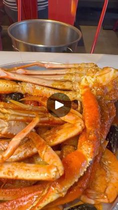 a plate full of cooked crabs and other seafood