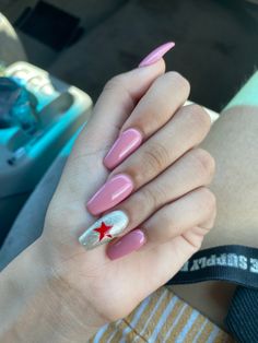 closed hand with light pink acrylic nails, ring nail with champagne base with red star. symbolizing the winter soldier from the marvel cinematic universe. Heart Nail Designs, Cute Halloween Nails, Winter Nail Art, Simple Nail Designs