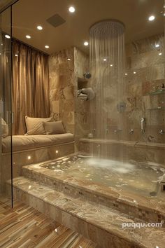 a bathroom with a large jacuzzi tub next to a couch and shower head