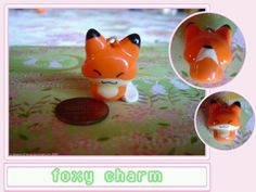 an orange fox figurine sitting on top of a green and pink table cloth