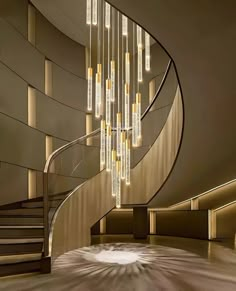 a spiral staircase with lights hanging from it