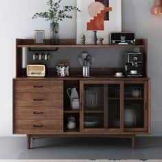 a wooden cabinet with many items on it