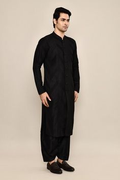 Black kurta crafted in bamberg raw silk base with pintuck detailing. Paired with a solid black salwar. - Aza Fashions Eid Straight Kurta With Pintucks, Eid Pintucks Straight Kurta, Traditional Sets With Pintucks For Eid, Traditional Eid Sets With Pintucks, Traditional Festive Kurta With Pintucks, Festive Traditional Kurta With Pintucks, Traditional Kurta With Pintucks For Eid, Black Cotton Silk Fitted Kurta, Black Fitted Cotton Silk Kurta