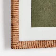 a wicker frame hanging on the wall