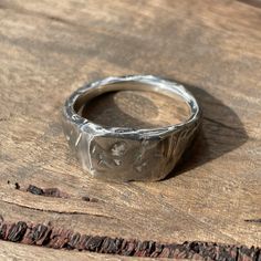 This beautifully textured, rugged version of our Small Square Signet Ring is ready for anything life throws at it. It's hip to be square... These timeless signet rings are meticulously crafted by hand in our Melbourne workshop, created out of wax and then cast into precious metal. Made with the highest quality Australian sterling silver to last forever. Made solid, not hollow like many others, all of our rings are hand-stamped with a Sterling Silver (925) hallmark and Custom Creed makers mark an Unique Hand Forged Signet Ring, Minimalist Hammered Signet Ring As Gift, Minimalist Hand Cast Sterling Silver Signet Ring, Minimalist Hand-cast Sterling Silver Signet Ring, Rustic Silver Untreated Rings, Rustic Untreated Silver Ring, Untreated Sterling Silver Rings With Rustic Style, Unique Signet Ring For Promise With Lost Wax Casting, Rustic Untreated Ring As A Gift