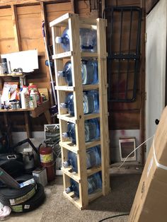 a storage rack filled with water bottles in a garage