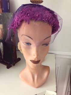 Really gorgeous in very good condition vintage 40's 50's facinator hat/ headband with netting in tack .. beautiful purple lavender pink colors .. woukd look excellent on any skin tone .. measurements in photos and does stretch . Purple Headband For Kentucky Derby, Adjustable Purple Headpiece For Evening, Purple Headband For Party, Adjustable Purple Headband For Evening, Vintage Purple Party Hat, Vintage Evening Fascinator Headband, Purple Headband Hats For Kentucky Derby, Purple Evening Headpieces, Fitted Purple Headband For Party