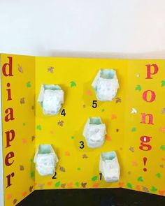 a paper board with baby diapers on it