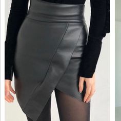 Black Skirt . Size Small The High Waist Is Highlighted By The Wide Waistband, While The Asymmetrical Hemline Adds Even More Provocation To The Length. Once Wearing Excellent Condition Luxury Black Asymmetrical Mini Skirt, Black Stretch A-line Mini Skirt, Leather Mini Skirts, Wide Waistband, Black Skirt, Womens Skirt, Genuine Leather, Mini Skirts, High Waisted