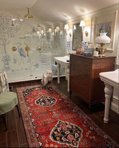 a bathroom with a rug, sink and mirror