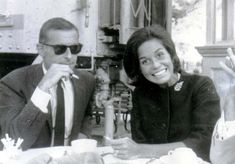 a man and woman sitting at a table