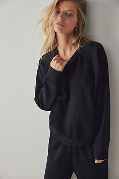 Made with recycled fleece, this so comfy pullover is featured in a relaxed-fitting silhouette with a classic design and a crewneck. * Raglan sleeves * Full-length fit * Fitted ribbed hemlines | Recycled Fleece Sweatshirt by Free People in Black, Size: S Black Top For Lounging In Fall, Relaxed Fit Crew Neck Tops For Lounging, Fleece Tops For Fall Lounging, Fleece Tops For Lounging In Fall, Fall Fleece Tops For Lounging, Cozy Relaxed Fit Sweats For Layering, Relaxed Fit Fleece Tops For Lounging, Long Sleeve Sweatshirt With Ribbed Cuffs For Relaxation, Crew Neck Sweatshirt With Ribbed Cuffs For Relaxation