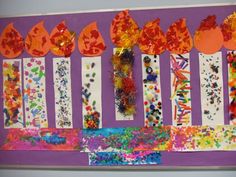 an art project with paper flowers and leaves on purple background, surrounded by other arts and crafts materials