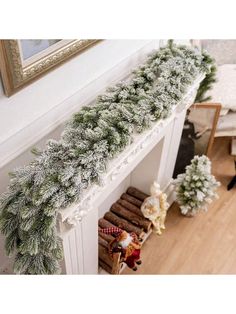 a christmas garland is hanging on the mantle