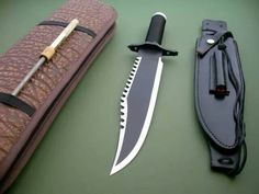 a knife and sheath laying next to each other on top of a green countertop