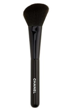 What it is: An angled powder brush. What it does: It's ideal for setting loose and pressed formulas, as well as sculpting cheeks and facial contours.- Made in France Chanel Makeup Bag, Makeup Collection Goals, Handbag Essentials, Eye Makeup Designs, Chanel Makeup, Dior Makeup, Foundation Shades, Contour Brush, Makeup Items