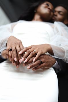 two people holding each other with their hands