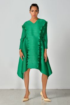 Emerald pleated dress with ruffle detailing in front and V neckline.
Components: 1
Type Of Work: Plain
Neckline: V neck
Sleeve Type: Full sleeves
Fabric: 100% Polyester
Color: Emerald Green
Other Details: 
Tie-up detailing
Occasion: Party - Aza Fashions Green Plain, Asymmetric Dress, Full Sleeves, Asymmetrical Dress, Women Dresses, Pleated Dress, Aza Fashion, Full Sleeve, Sleeve Type