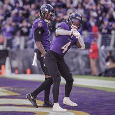 two football players on the field during a game