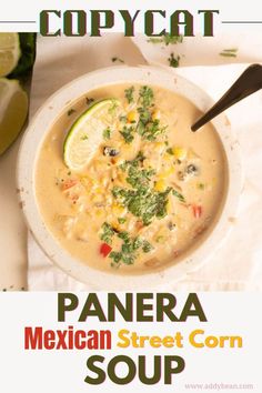 a bowl of mexican street corn soup with limes and cilantro