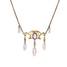 Stylish and finely detailed Art Nouveau drop necklace (circa 1900s to 1910s) crafted in 14 karat yellow gold.   One estimated .75 carat amethyst, 6mm x 3.5mm to 9mm x 3mm sawtooth pearls and enamel are set into the necklace. The amethyst is in very good condition and free of cracks or crisps. Note: slight chip to enamel.    The beautifully made Art Nouveau necklace highlights the faceted centre set oval amethyst with accenting purple and white enamel. Natural pearls are set in a fringe style to Art Nouveau Necklaces, Detailed Art, Fringe Fashion, Detail Art, Drop Necklace, White Enamel, Natural Pearls, Make Art, Antique Art