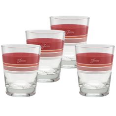 four glasses with red and white stripes on the bottom are set in front of each other