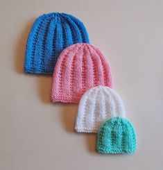 three crocheted hats sitting next to each other