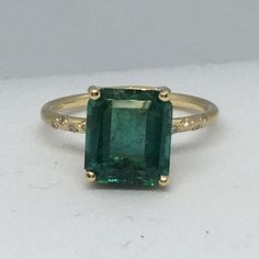 14K Yellow Gold GreenTourmaline Diamond Ring Size 7 4.40Ct Green Tourmaline measuring 10mm by 8.8mm Ring size 7 weighting 2.8 gram 8 pieces of 1mm diamonds weighting total of .04 Carat in Zigzag Pave style setting Made in Santa Monica, USA Elegant Emerald Cut Tourmaline Jewelry, Luxury Tourmaline Ring With Center Stone, Emerald Cut Tourmaline Jewelry With Accent Stones, Yellow Gold Tourmaline Emerald-cut Ring, Gia Certified Tourmaline Jewelry For Anniversary, Elegant Emerald-cut Tourmaline Ring, Elegant Emerald Cut Tourmaline Ring, Formal Tourmaline Emerald Ring With Prong Setting, Fine Jewelry With Baguette Cut Tourmaline