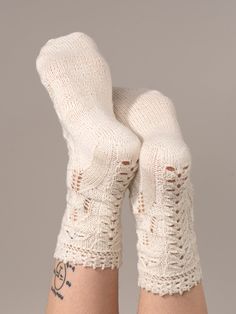 A top-down sock in one size, composed of ornate, sculpted stitches fit for the Queen Bee. Patterns extend down the back of the heel and over the top of the foot. May be resized by substituting needles and/or yarn. Not reversible for toe-up construction. Fun Fact: The Ohio city of Marietta is named after this queen!Learn more about Marie Antoinette here. Shown here in Modern Deco Lace, Titanium Shade Shop the Marie Antoinette Sock Kit and save 50% Off the PDF pattern Suggested Yarns: Modern Deco Cozy Handmade Knitting Pattern, Handmade Fitted Cozy Socks, Ohio City, Stitch Fit, Modern Deco, Queen Bee, Top Down, Marie Antoinette, Over The Top