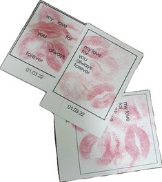 two cards with pink lipstick imprints on them