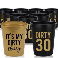 it's my dirty thirty birthday party cups in gold and black with the number 30 printed on them