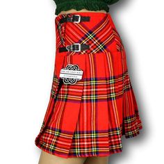 The women's tartan billie skirt is a stylish and versatile garment that combines classic Scottish heritage with contemporary fashion. Made from high-quality tartan fabric, the billie skirt showcases a beautiful array of colors and patterns, reflecting the rich tradition of Scottish plaids. The skirt features a flattering A-line silhouette that flares out from the waist, creating a feminine and elegant look. It typically falls just above or below the knee, offering a modest yet fashionable length Scottish Plaid Skirt For Fall, Scottish Style Plaid Skirt For Fall, Fall Scottish Plaid Skirt, Fall Scottish Pleated Skirt, Scottish Style Fitted Pleated Skirt For Fall, Scottish Red Skirt For Fall, Scottish Style Fitted Pleated Skirt, Red Scottish Style Fitted Bottoms, Red Tartan Fitted Bottoms