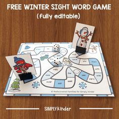 the free winter sight word game is displayed on a wooden table with an image of a snowman