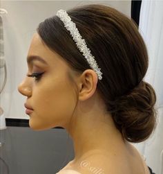 a woman wearing a bridal hair comb