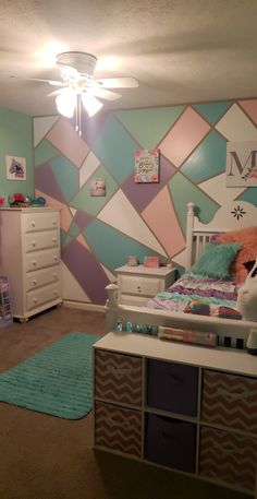 a child's bedroom decorated in pastel colors