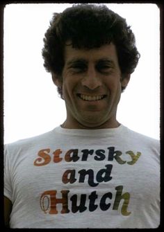 a man wearing a t - shirt that says starky and hutch