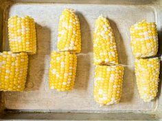 corn on the cob is cut up and ready to be cooked in the oven