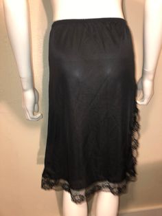 "Vintage black slip skirt small Measurements waist: 26-28\" hips: 38\" length: 24\" Nylon" Black Knee-length Mini Skirt For Summer, Sheer Mini Skirt For Night Out, Black Mini Bottoms With Lace Trim, Black Sheer Mini Skirt, Black Lace Trim Mini Skirt For Summer, Sheer Skirt For Night Out, Black Stretch Midi Skirt, Spring Black Skirt With Lace Trim, Black Skirt With Lace Trim For Spring