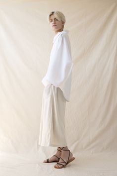 Unique white shirt, Minimalist natural linen shirt, Loose white shirt, Would make a perfect gift. A unique minimalist white kimono top. This turtleneck shirt is extremely comfortable, flattering and versatile. Made of pure linen and sewn with extreme precision by the hand of a tailor, this boho top features a fresh and trendy design that is perfect for you the free-spirited men & women. Wear this fresh and trendy top to any occasion and get ready to wow the crowds. ~ Returns and exchanges accept Loose White Shirt, Linen Oversized Shirt, Linen Wrap Top, White Kimono, Free Spirited Woman, Festival Pants, Minimalist White, Linen Shirts, Wrap Crop Tops