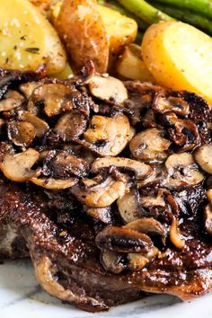 steak with mushrooms, potatoes and asparagus on a plate