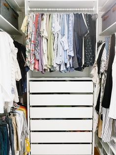 a closet filled with lots of clothes next to a white dresser and shelves full of shirts