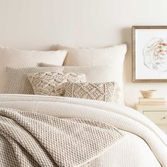 an image of a bedroom setting with blue and white stripes on the wall behind it