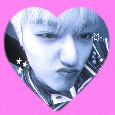 a woman with blonde hair and piercings in a heart shaped photo