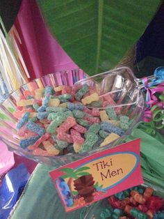 a bowl filled with cereal next to a sign that says tiki men on it