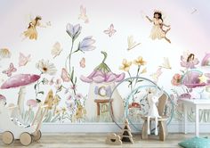 a child's room with flowers and fairy wallpaper