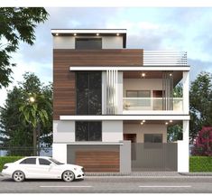 a white car parked in front of a two story house with balconies on the second floor