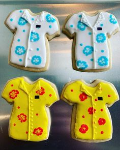 three decorated cookies in the shape of baby ones