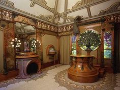 an elaborately decorated room with mirrors and furniture