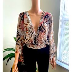 Fashion Nova Sunset In Your Eyes Multicolored Floral Top, 1x, 100% Polyester Elegant Multicolor Beach Blouse, Plunging Neckline Top, White Crochet Crop Top, Long Sleeve Corset Top, Multicolor V-neck Peasant Top With Floral Print, Bohemian V-neck Floral Print Crop Top, Black Peplum Top, Multicolor Floral Print V-neck Top, Orange Floral Print V-neck Top